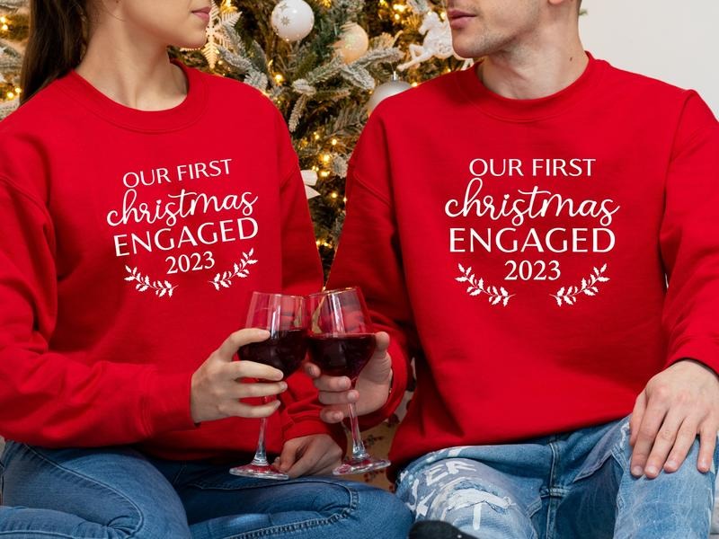 Our First Christmas Engaged 2023 Sweatshirt, Matching New Engaged Couple Xmas Hoodie, Engagement Gift Holiday Sweater, Fiancé And Fiancée Christmas Outfit.