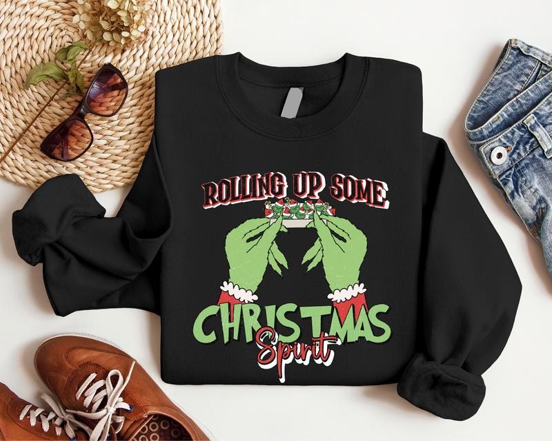 Rolling Up Some Christmas Spirit Sweatshirt, Funny Christmas Gift Hoodie, Trendy Sweatshirt For Christmas, Retro Christmas Long Sleeve, Smoking Christmas Hoodie.