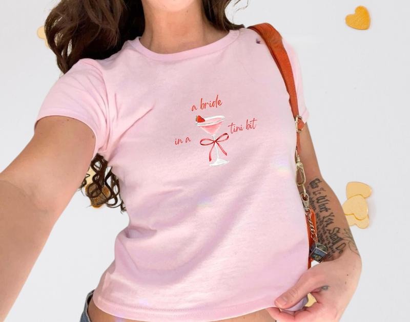 [Sale up to 60%] A Bride in A Tini Bit Bachelorette Baby Tee, Y2k Trending Bachelorette Party Baby Tee, Bride to Be Bridal Party Gift, Wedding Gift